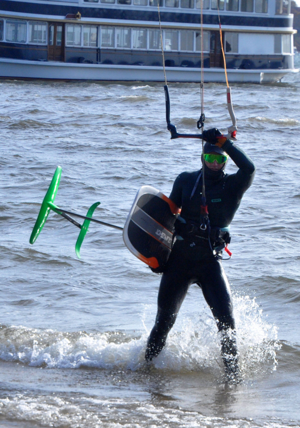 Charlie Vogel returns to Riviera Beach as a finishes a kite boarding lap on Geneva Lake